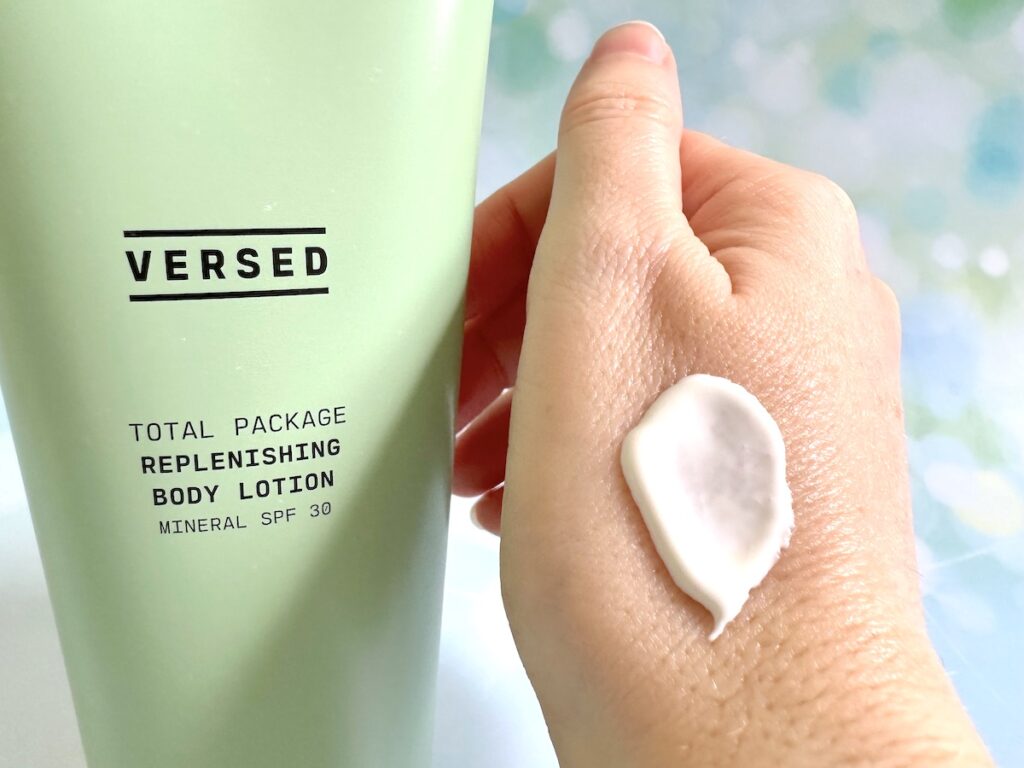 Versed Total Package Replenishing Body Lotion Mineral SPF 30, tube next to sample on hand.