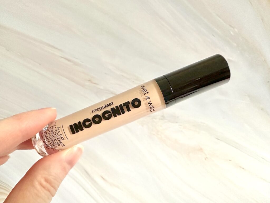 Wet n’ Wild Megalast Incognito Concealer in the shade Light Beige, handheld.