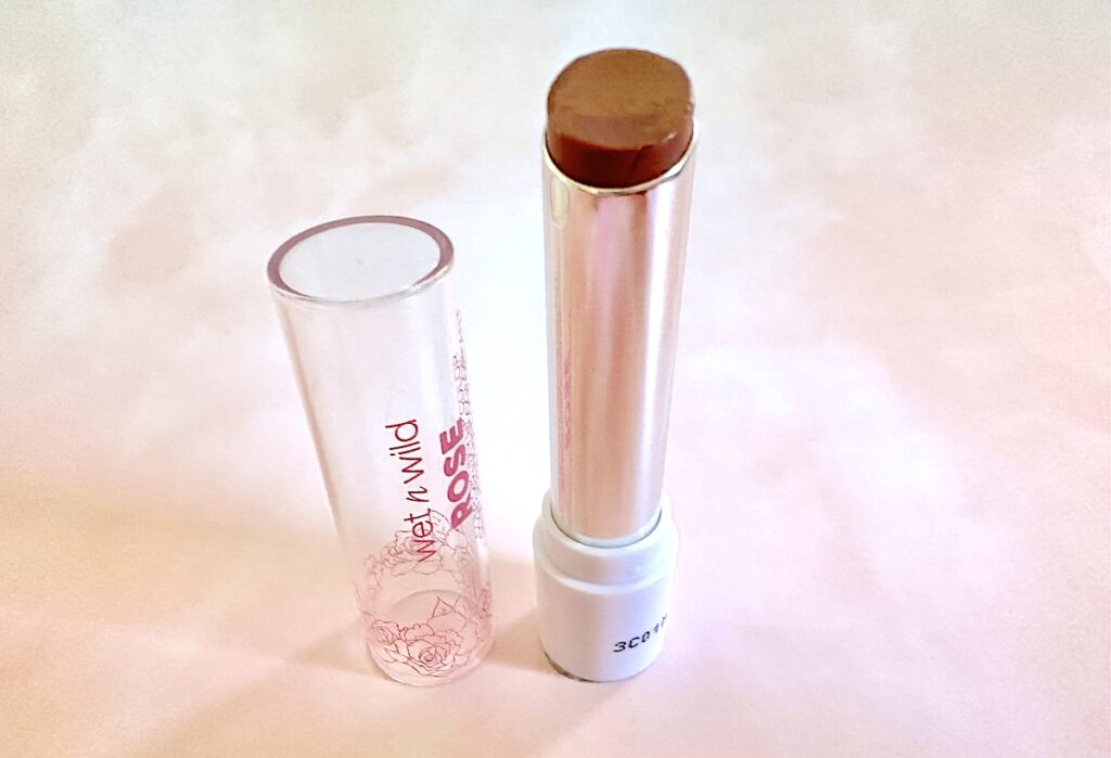 Wet n Wild Rose Comforting Lip Color in the shade Taffy Daddy, lid removed.