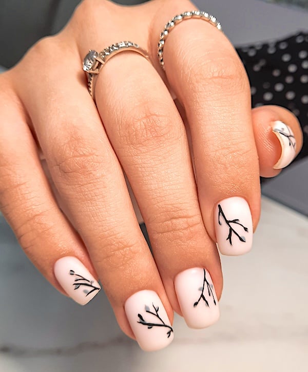 Short white nails with black branches.