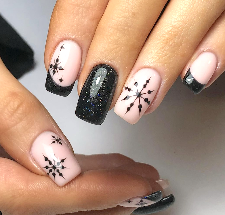 Black winter snowflake nails.