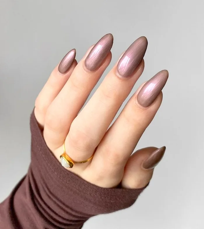 Brown chrome nails.