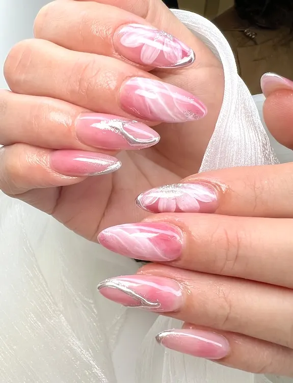 Silver pink almond nails.