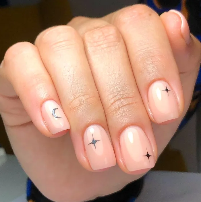 Moon and star minimalist nails.