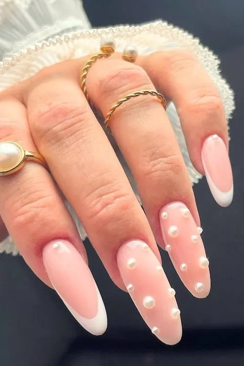 Pearl coquette nails.