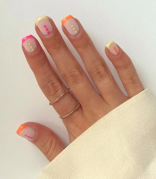 Colorful dots French tip nails.