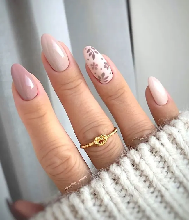 Neutral floral almond nails.