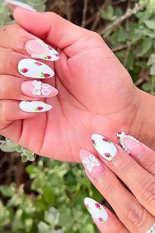 Strawberry pearl bow nails.