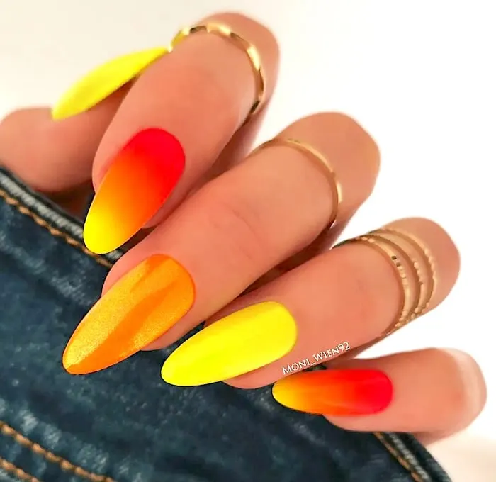 Candy corn orange yellow neon nails.