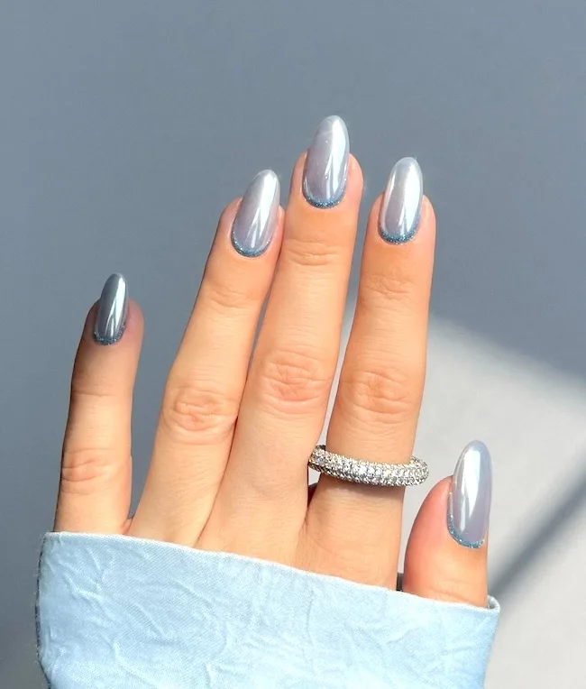 Blue silver chrome nails.