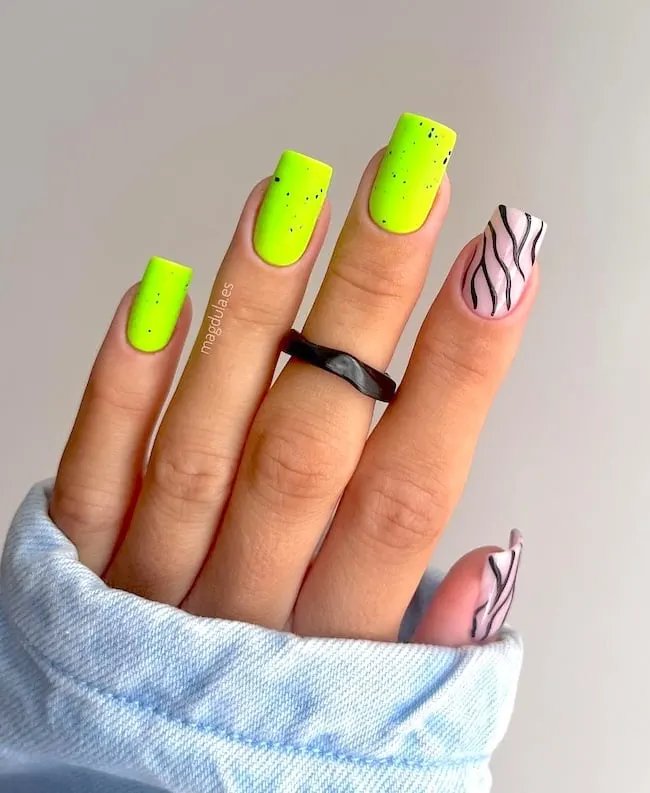 Lime green and black swirl neon nails.