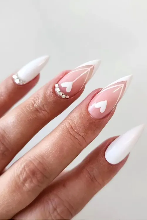 Heart French tip nails.