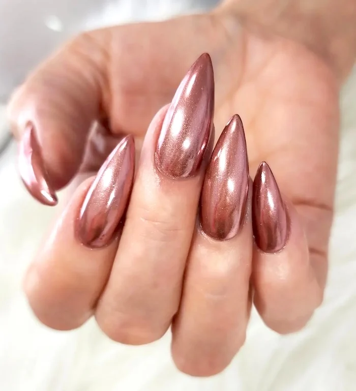 Rose gold chrome nails.