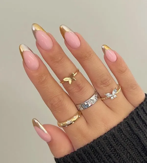 Gold-tipped almond nails.