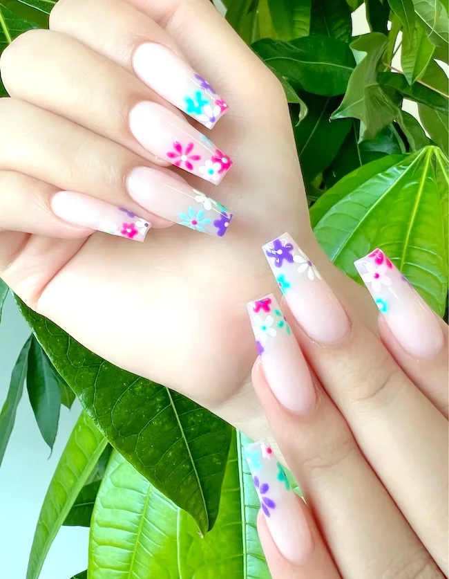 Flower French tip coffin nails for the month of April.