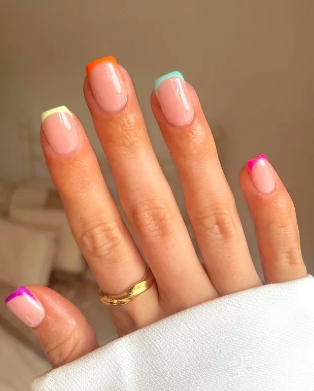 Bright French tip manicure.