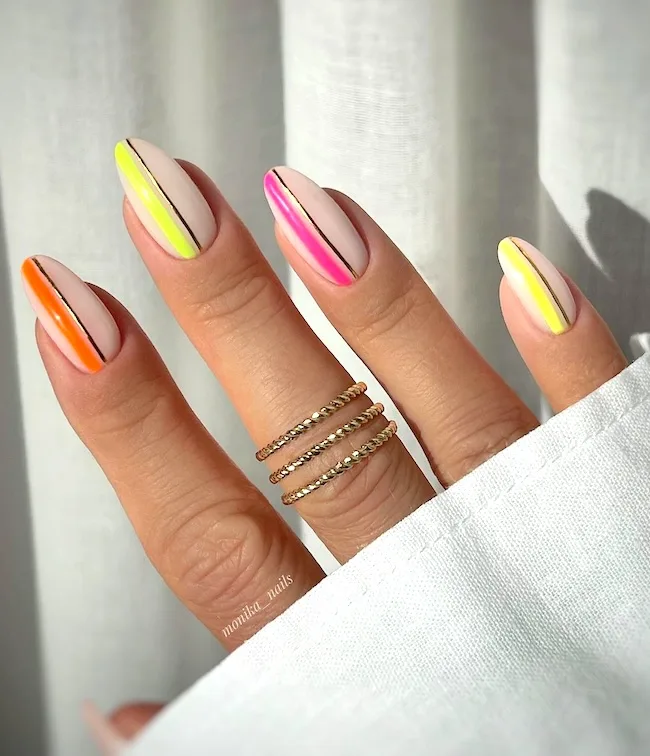 Bright neon lines almond nails.