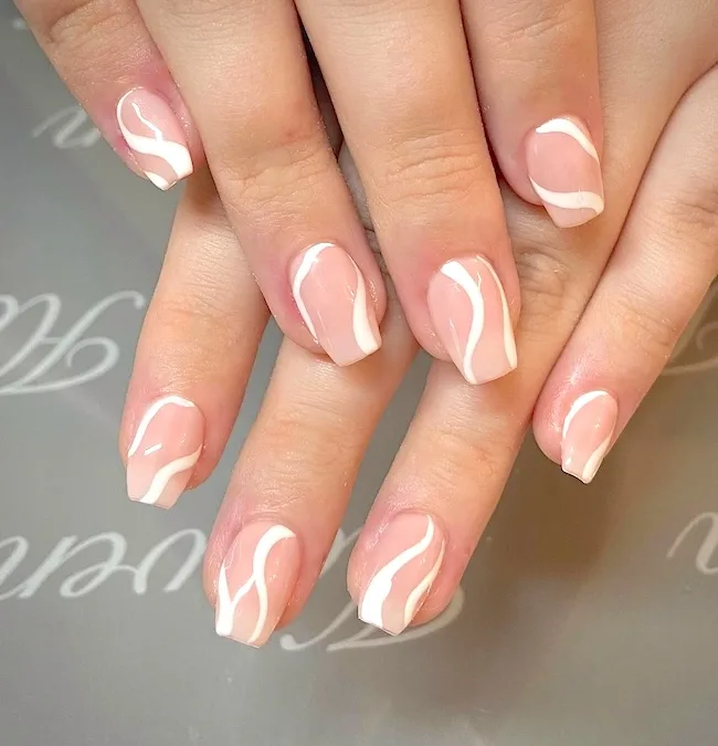 White swirl nude nails.