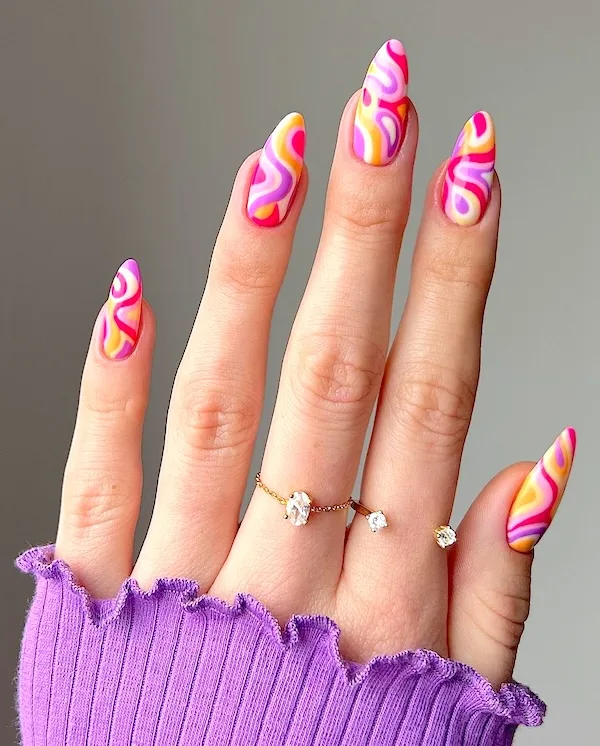 Colorful swirl almond nails.