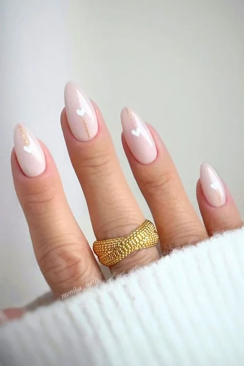 Minimal white heart almond nails.