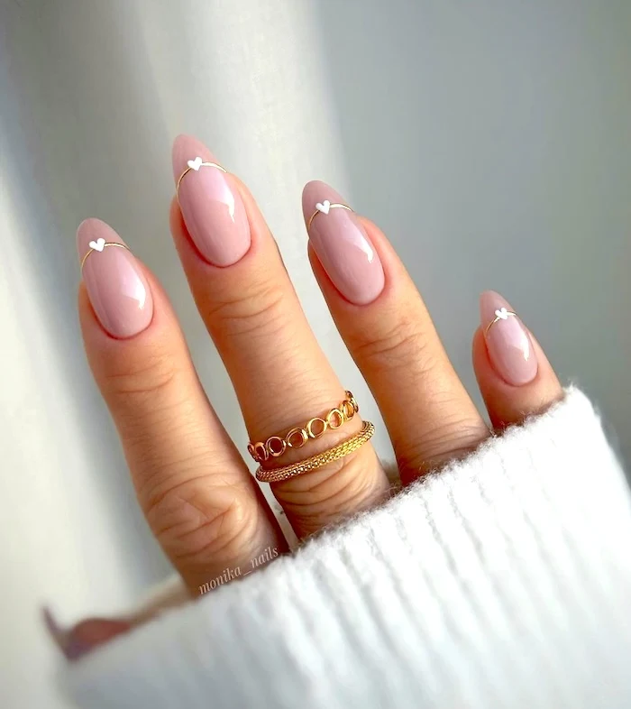 Minimalist pink hear nails.