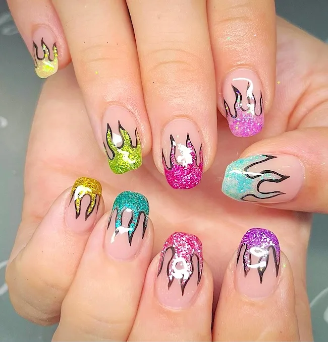 Colorful flames French tip nails.