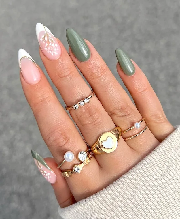 Olive almond flower nails with gold jewelry.