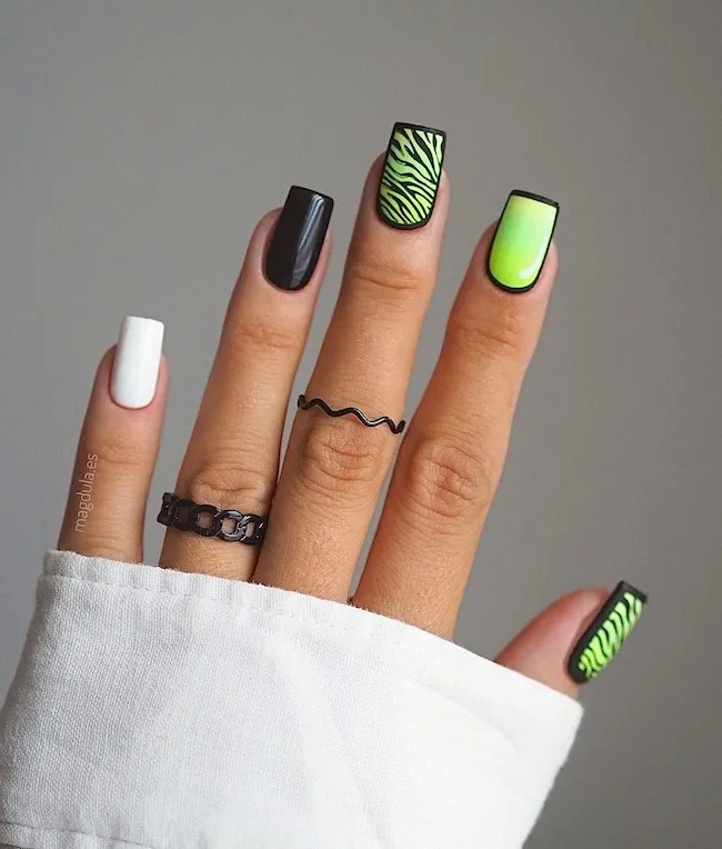 Green black neon nails.