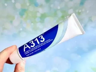 A313 Cosmetic Cream With Retinyl Palmitate, handheld.