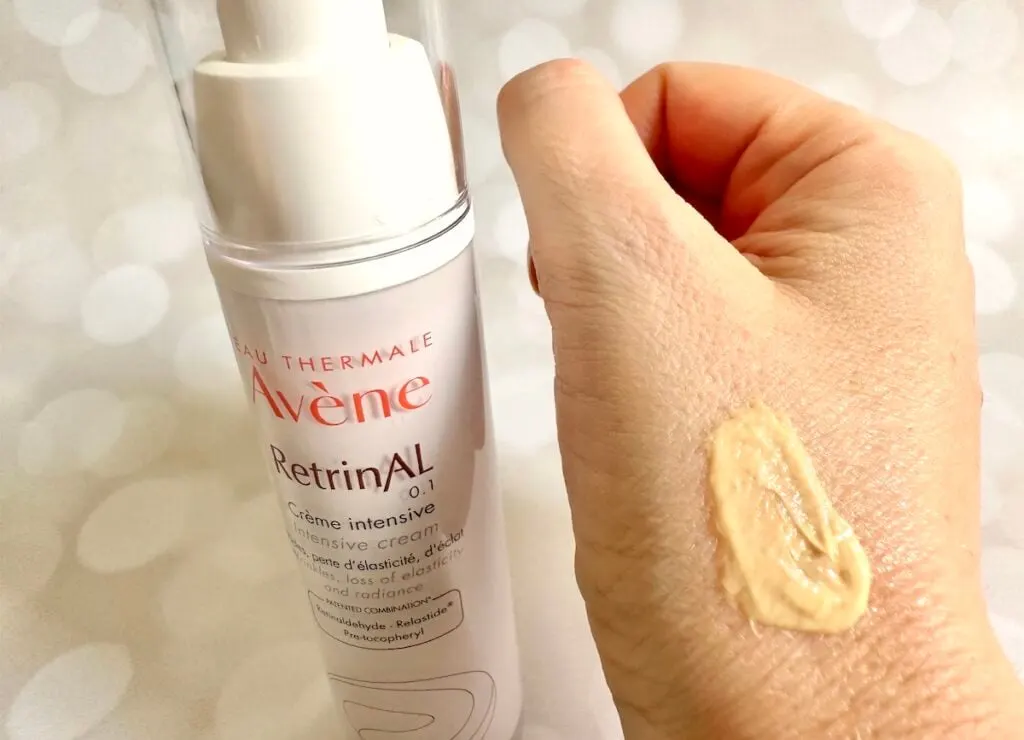 Avene RetrinAL 0.1 Intensive Cream bottle next to sample on hand.