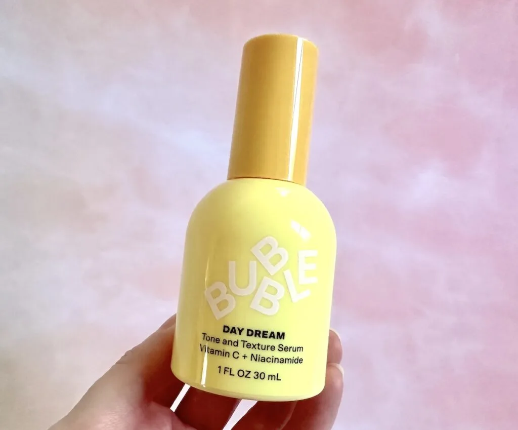 Bubble Day Dream Vitamin C + Niacinamide Tone & Texture Serum, handheld.