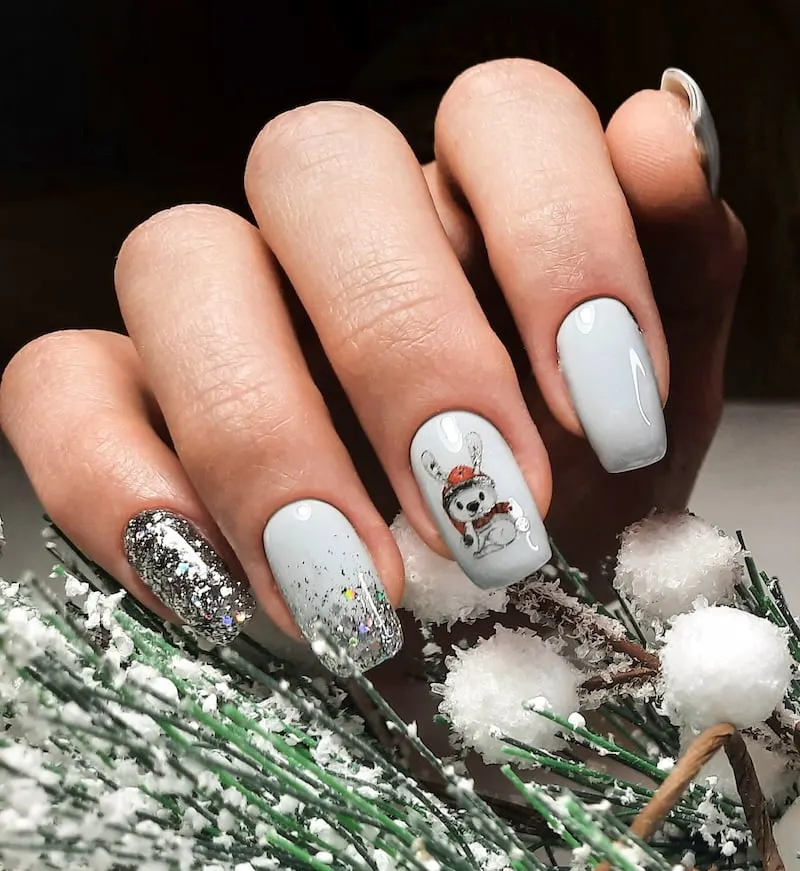 Bunny white winter nails with glitter.