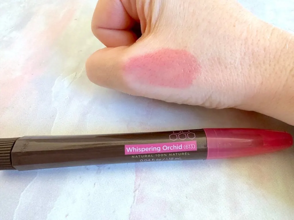 Burt's Bees Tinted Lip Oil in the shade Whispering Orchid, sampled on hand.