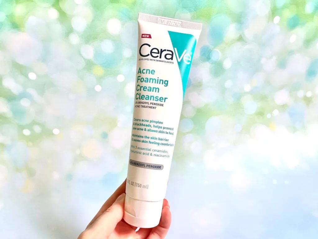 CeraVe Acne Foaming Cream Cleanser, handheld.