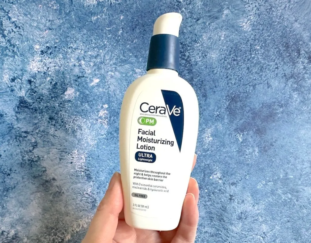 CeraVe PM Facial Moisturizing Lotion handheld.