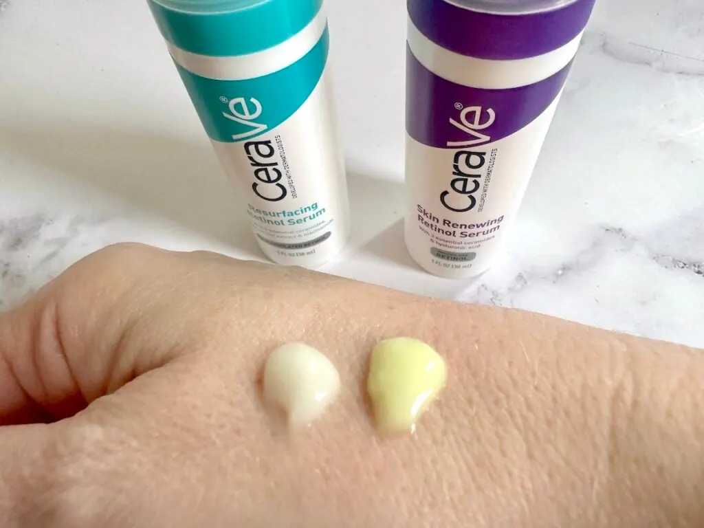 CeraVe Resurfacing Retinol Serum and CeraVe Renewing Retinol Serum bottles and sampled on back of hand.