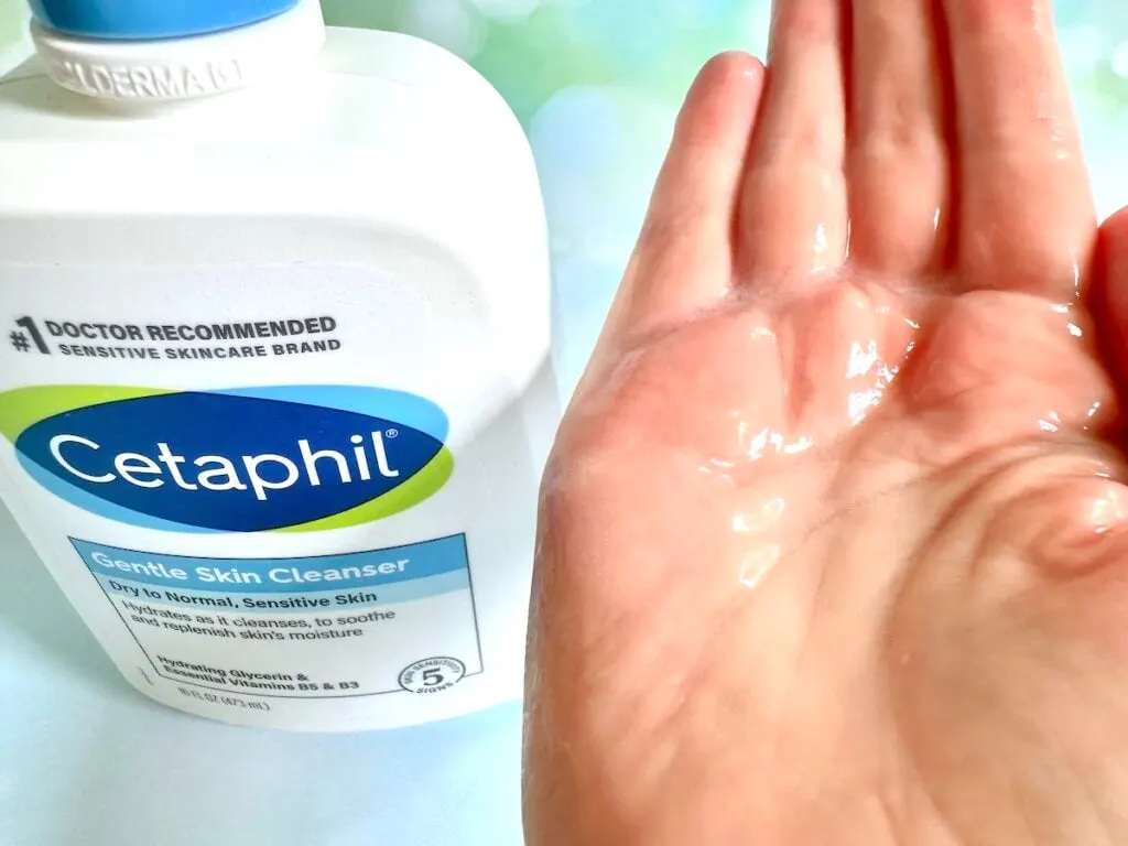 Cetaphil Gentle Skin Cleanser bottle next to sample of gel cream with water added in palm of hand.