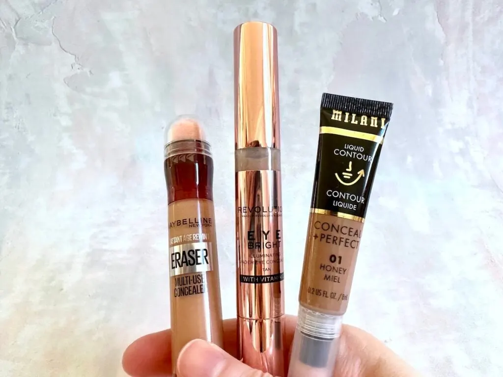 Charlotte Tilbury Contour Wand dupes from Maybelline, Makeup Revolution and Milani, handheld.