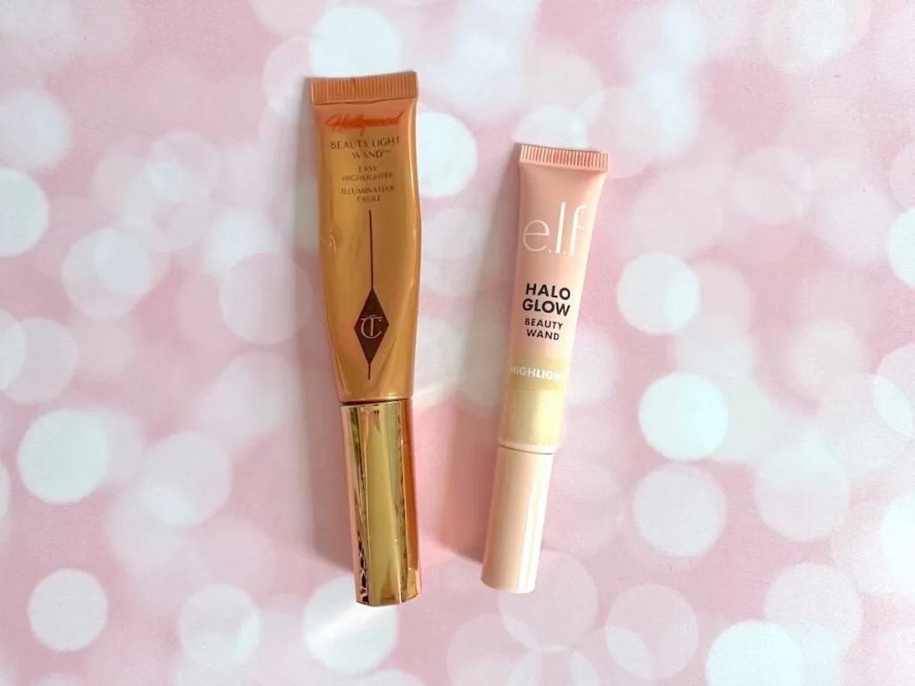 Charlotte Tilbury Hollywood Beauty Light Wand in the shade Spotlight and e.l.f. Halo Glow Highlight Beauty Wand in the shade Champagne Campaign, flatlay.