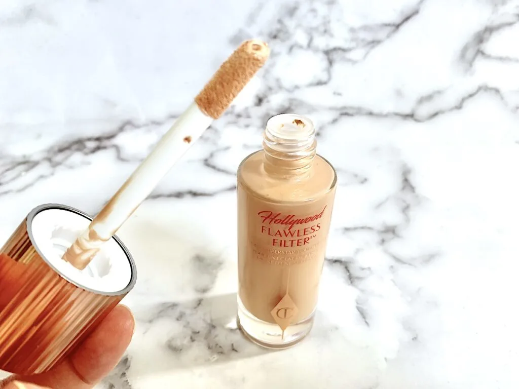 Charlotte Tilbury Flawless Filter applicator wand and open bottle.