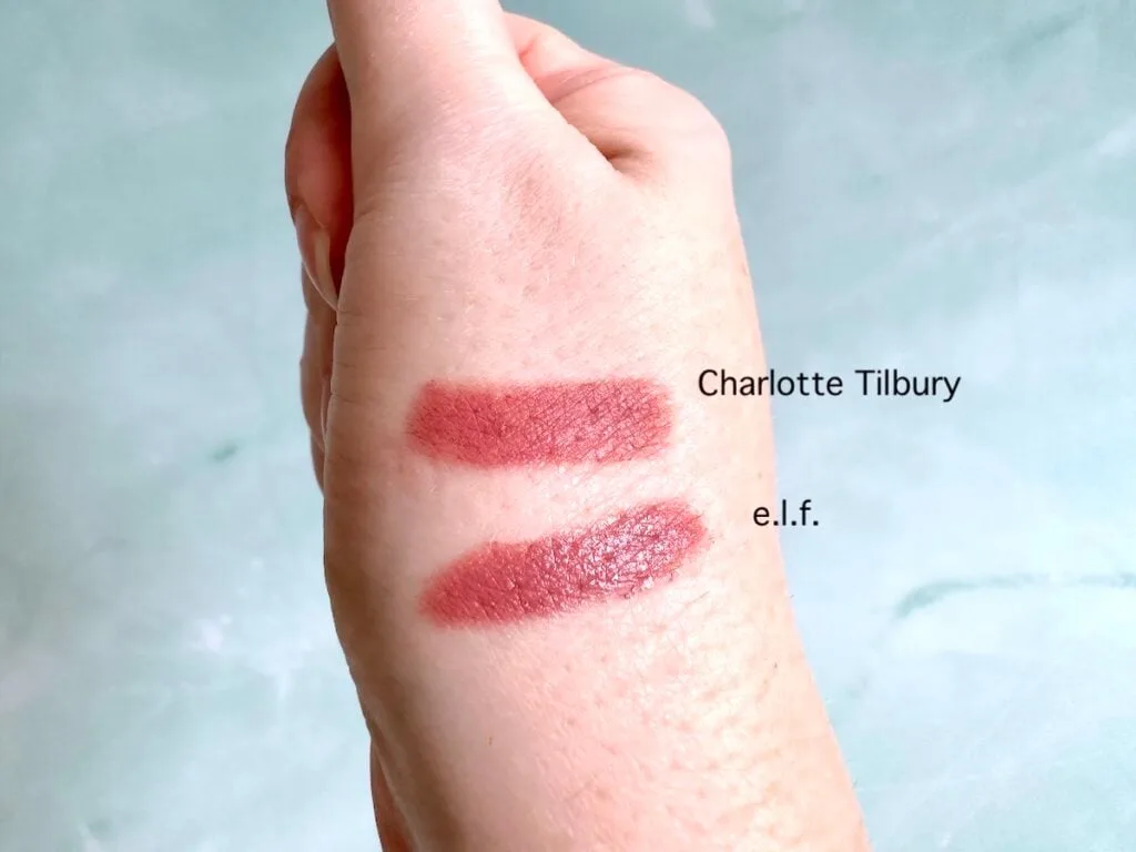 Charlotte Tilbury Pillow Talk lipstick and e.l.f O Face Satin Lipstick in Dirty Talk, sampled on hand.