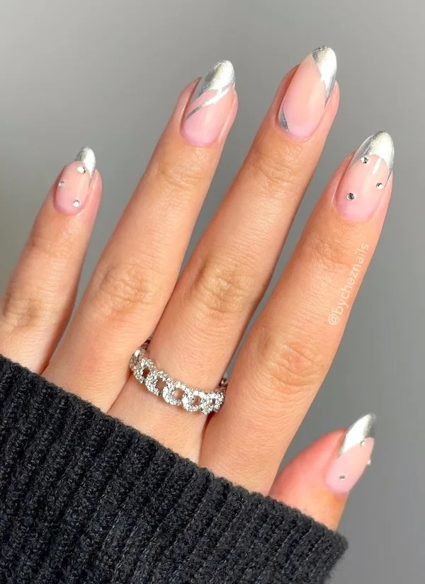 Silver accents and chrome French tip nails.