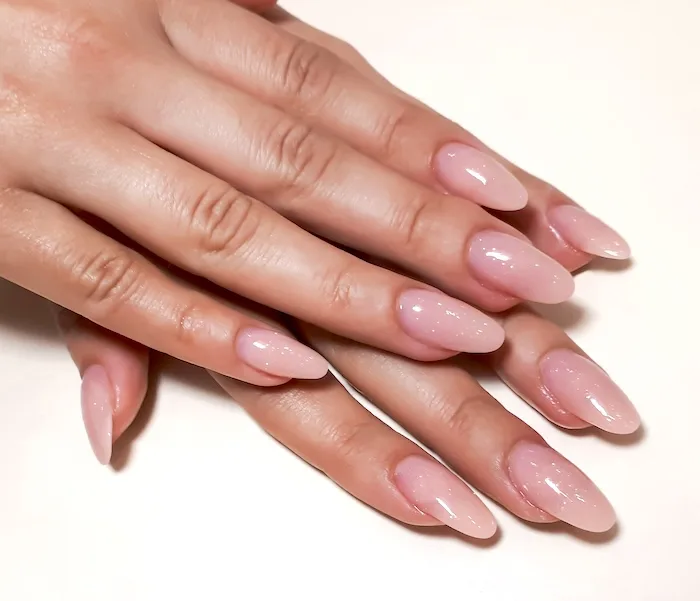 Pink almond nails.