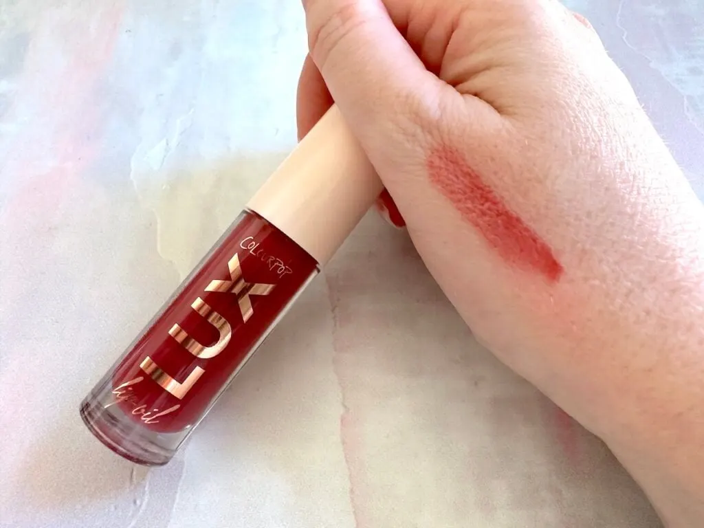 ColourPop Lux Lip Oil in the shade Bengal, sampled on hand.