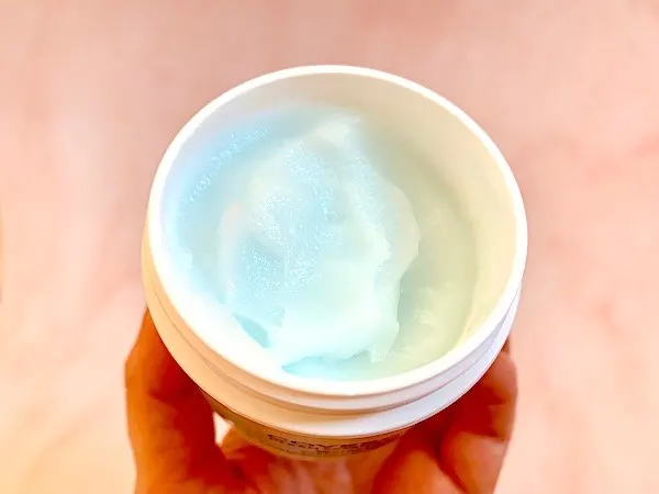 CoverGirl Clean Fresh Weightless Water Cream Moisturizer lid removed and blue product displayed