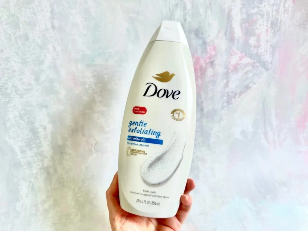 Dove Gentle Exfoliating Body Wash with Sea Minerals, handheld.