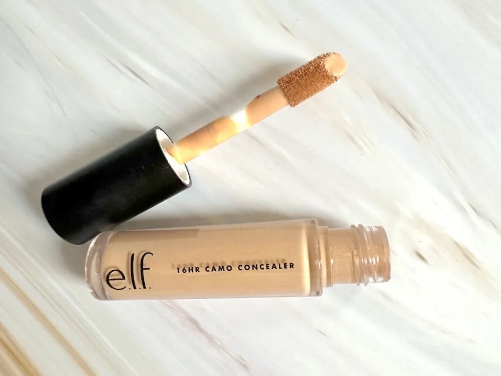 e.l.f. 16HR Camo Concealer in the shade Medium Beige, open tube with applicator wand, flatlay.