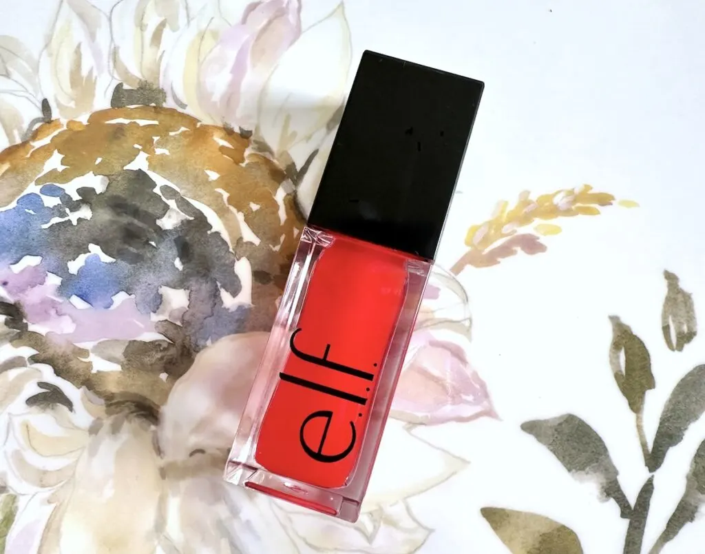 E.l.f. Glow Reviver Lip Oil in the shade Red Delicious, flatlay.