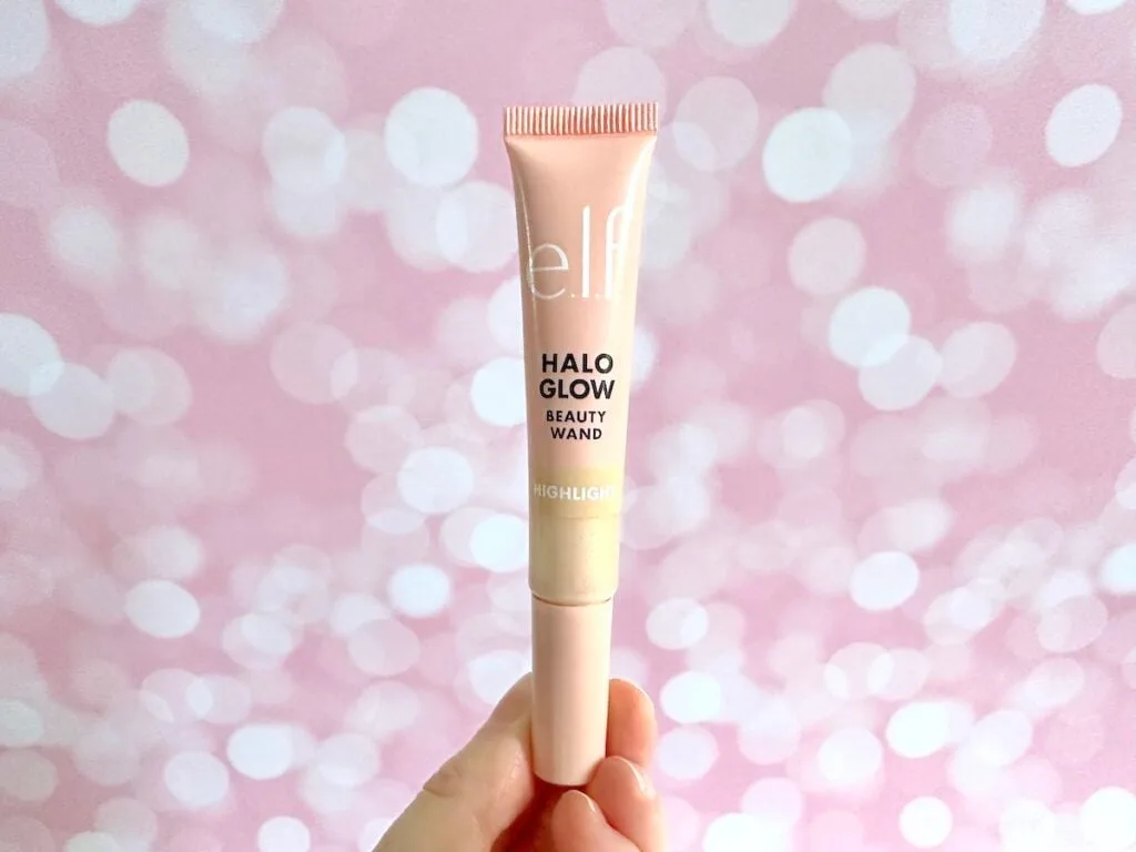 e.l.f. Halo Glow Highlight Beauty Wand in the shade Champagne Campaign, handheld.