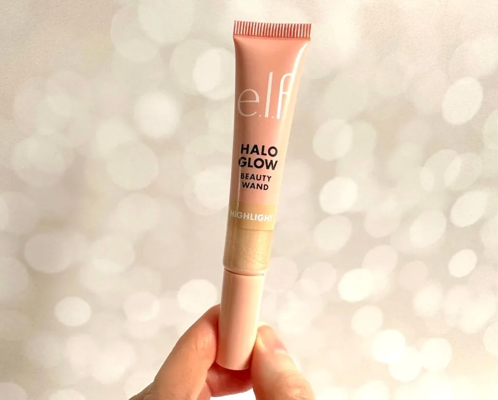 e.l.f. Halo Glow Highlight Beauty Wand in the shade Champagne Campaign, handheld.